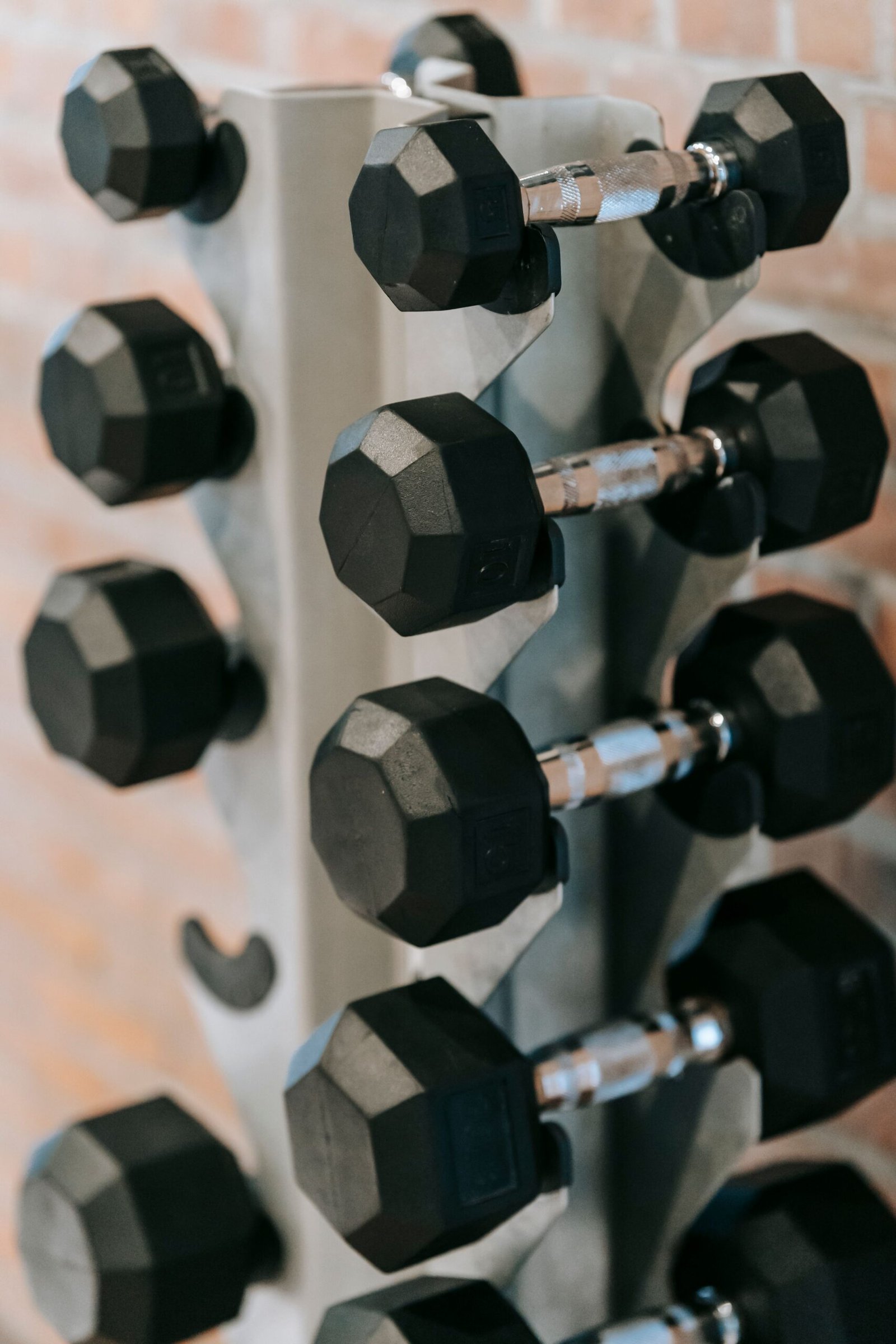 A full rack of fixed dumbbells that one adjustable pair can replace