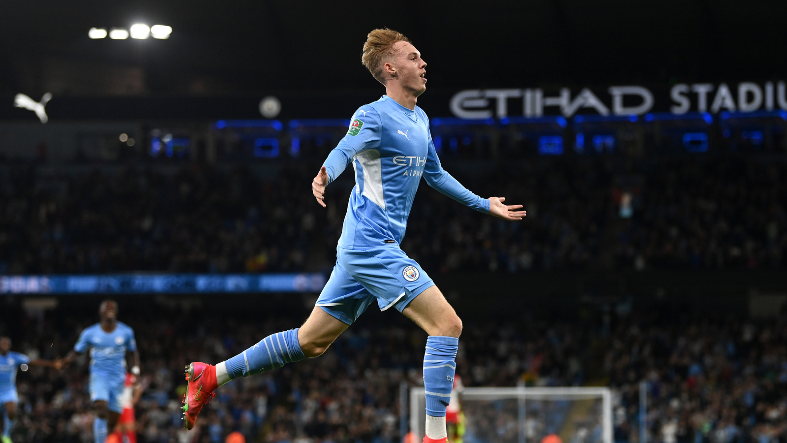 Young Cole Palmer celebrating a goal for Manchester City at the Etihad in 2021