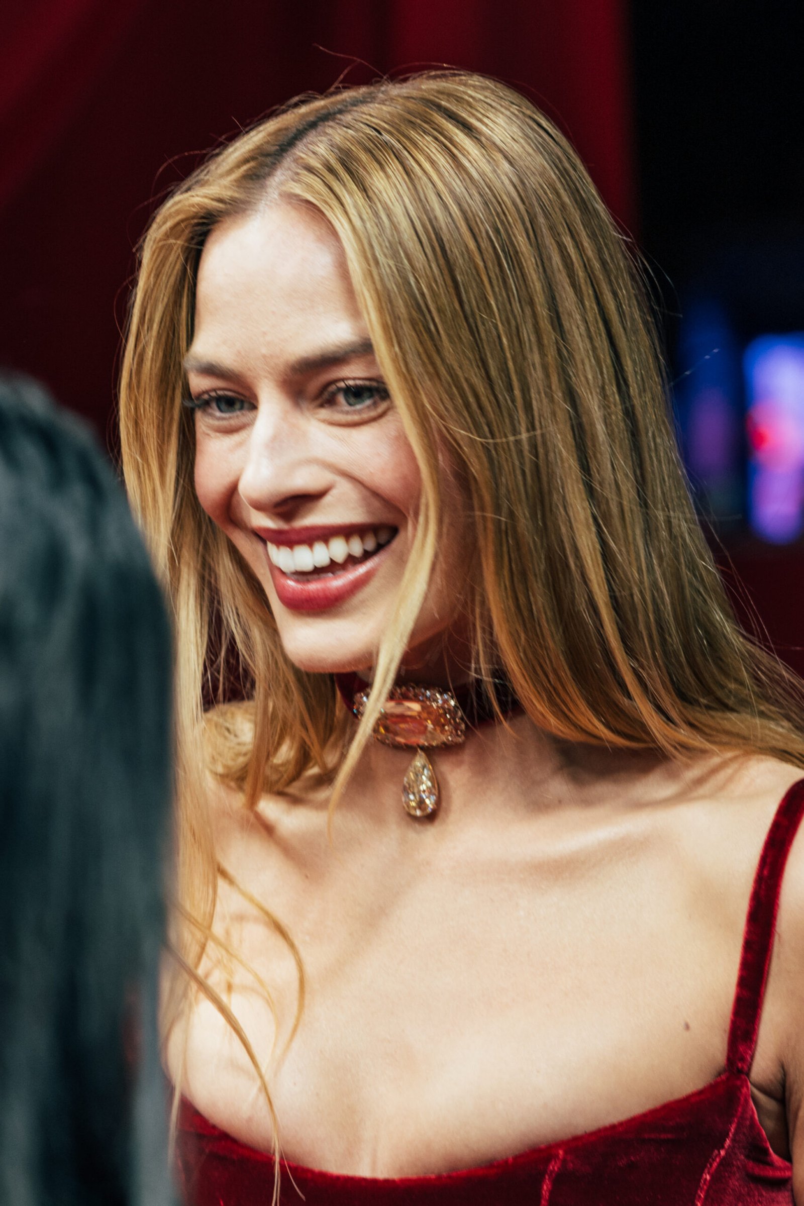 Margot Robbie smiling at the Paris premiere of Wuthering Heights in 2026