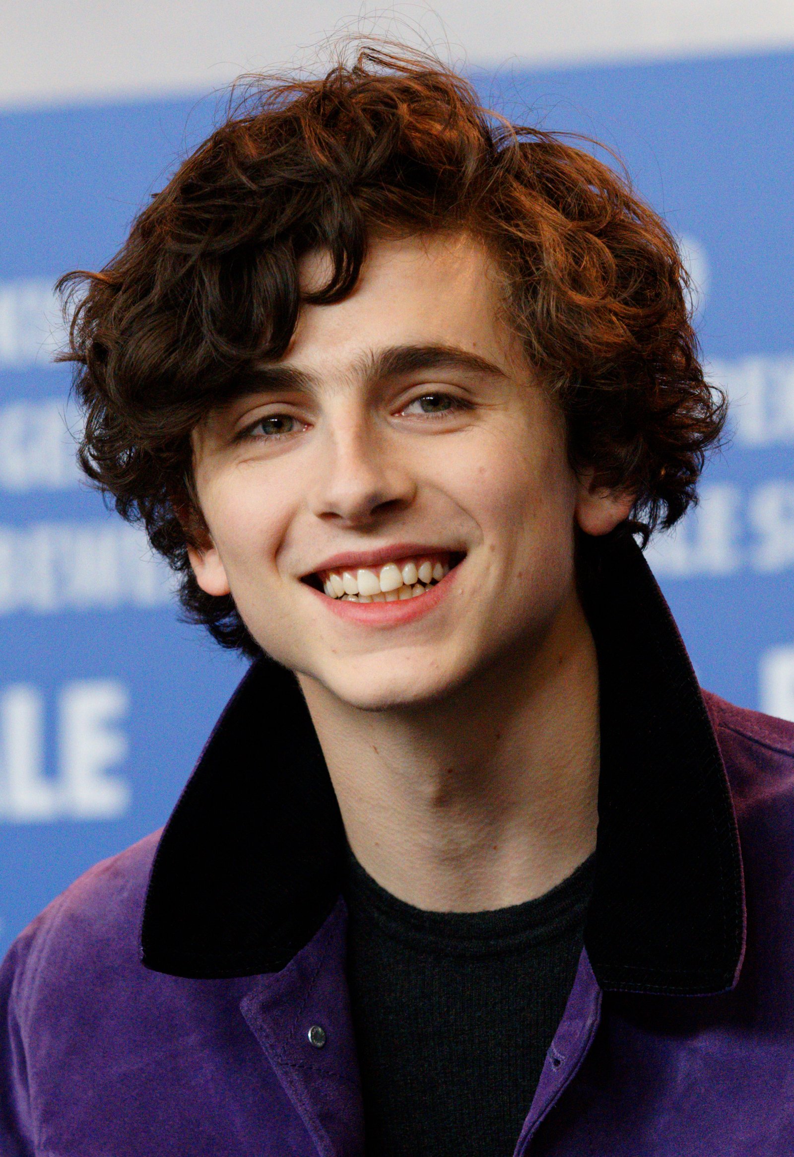 Timothée Chalamet smiling at the Call Me by Your Name press conference at the Berlinale in 2017