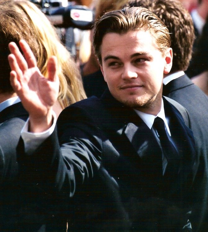 A young Leonardo DiCaprio waving to fans at the 2002 Cannes Film Festival