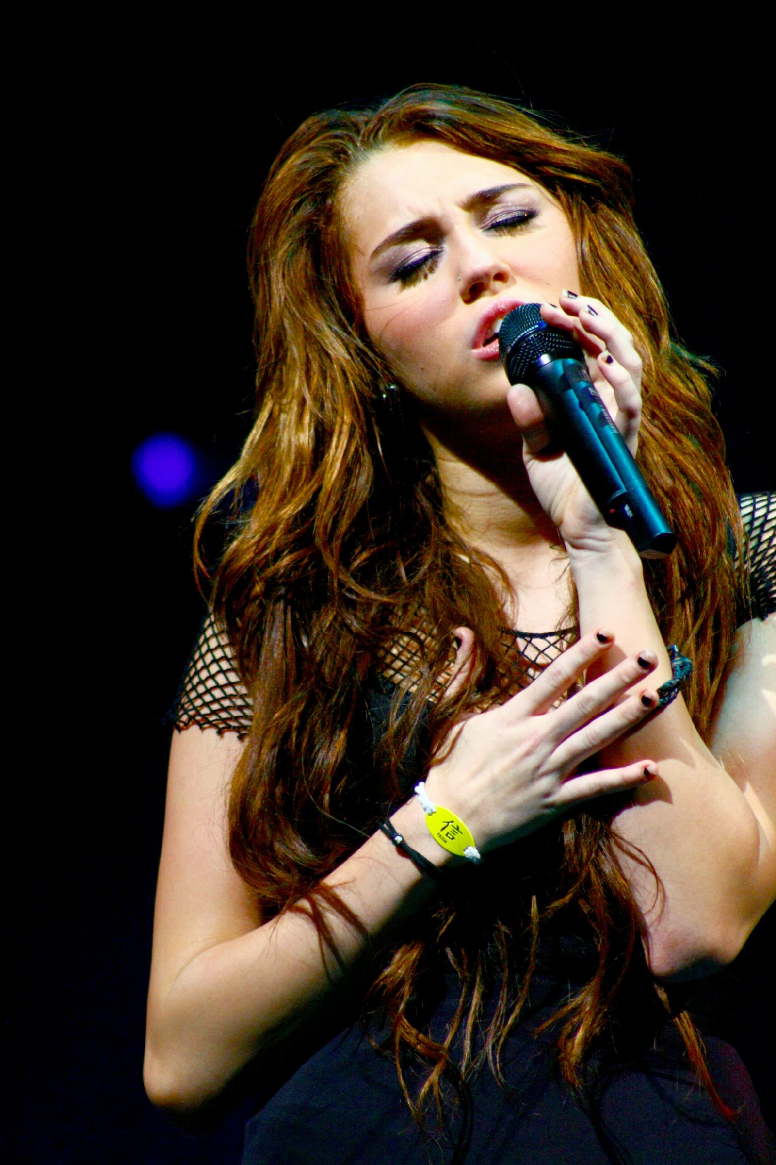Miley Cyrus performing on her Wonder World Tour in 2009